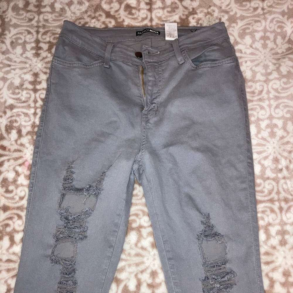 Gray high waisted ripped jeans.